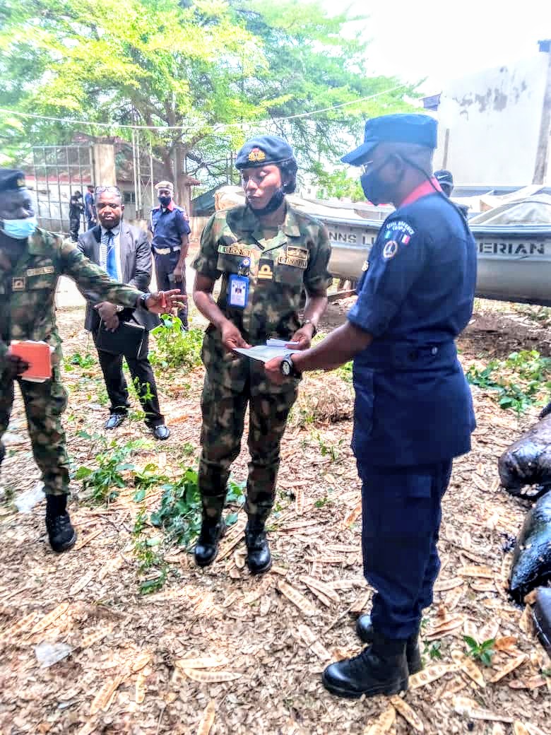 Navy Hands Over 304 (50kg) Bags of Crude Oil, Wooden Boat, 2 Suspects to NSCDC In Kogi