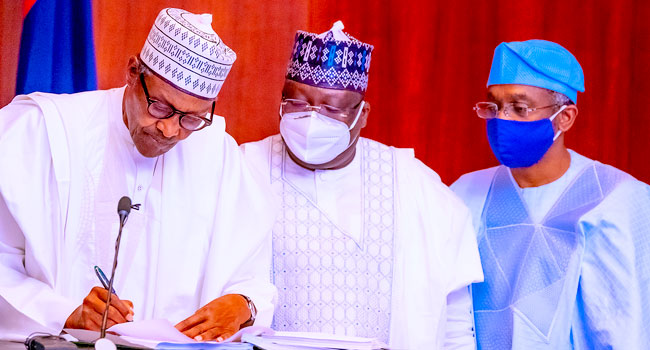 Buhari Signs Money Laundering, Terrorism Bills Into Law